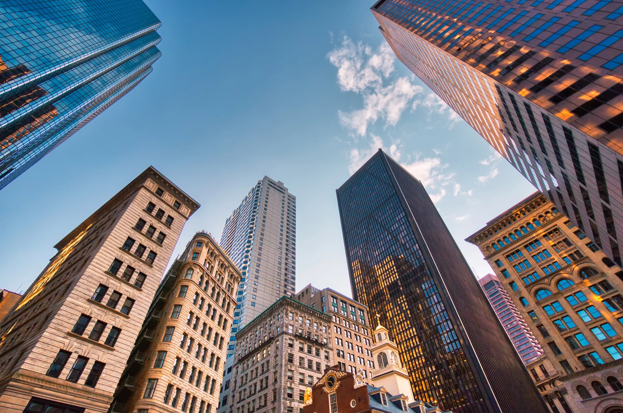 Looking up at tall buildings