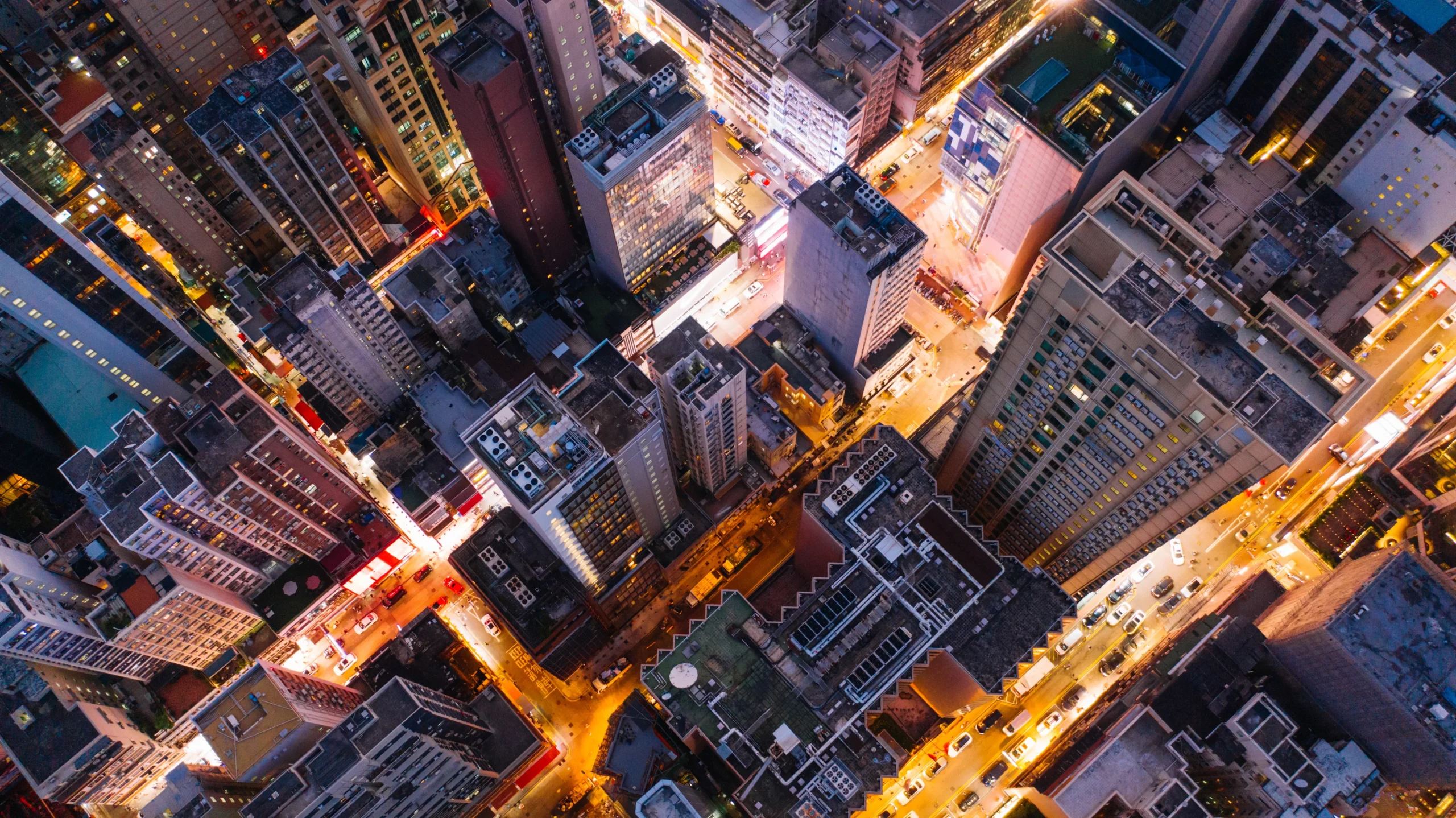 Top down view of lit cityscape at night