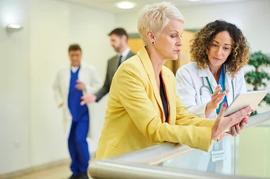 Doctor and colleague reviewing file